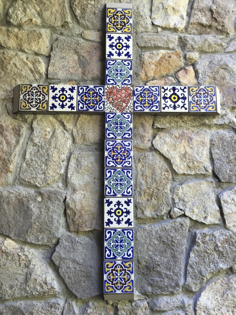 A beautiful cross we made on the side of my porch. A friend had given me these tiles but we lacked one to make it complete.